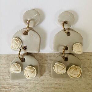 Grey handmade clay earrings with white roses